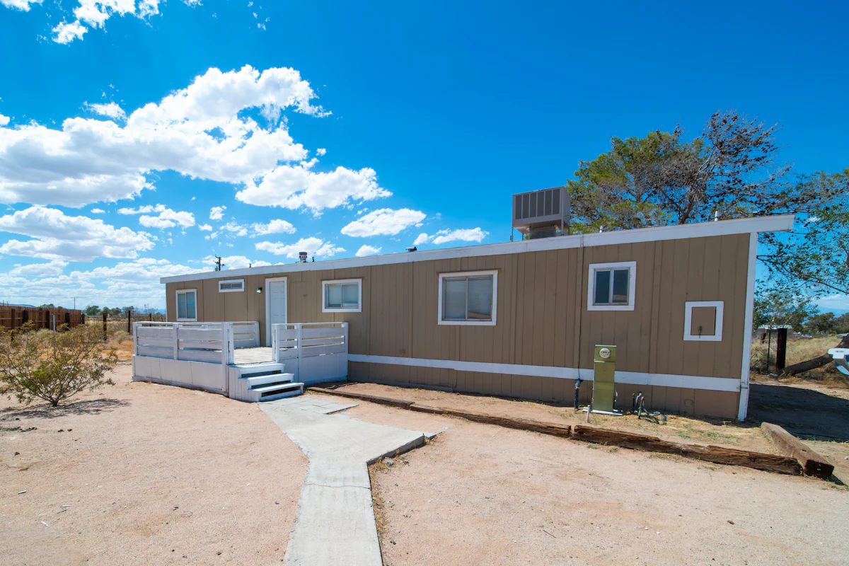 Triple wide mobile home exterior with covered entry